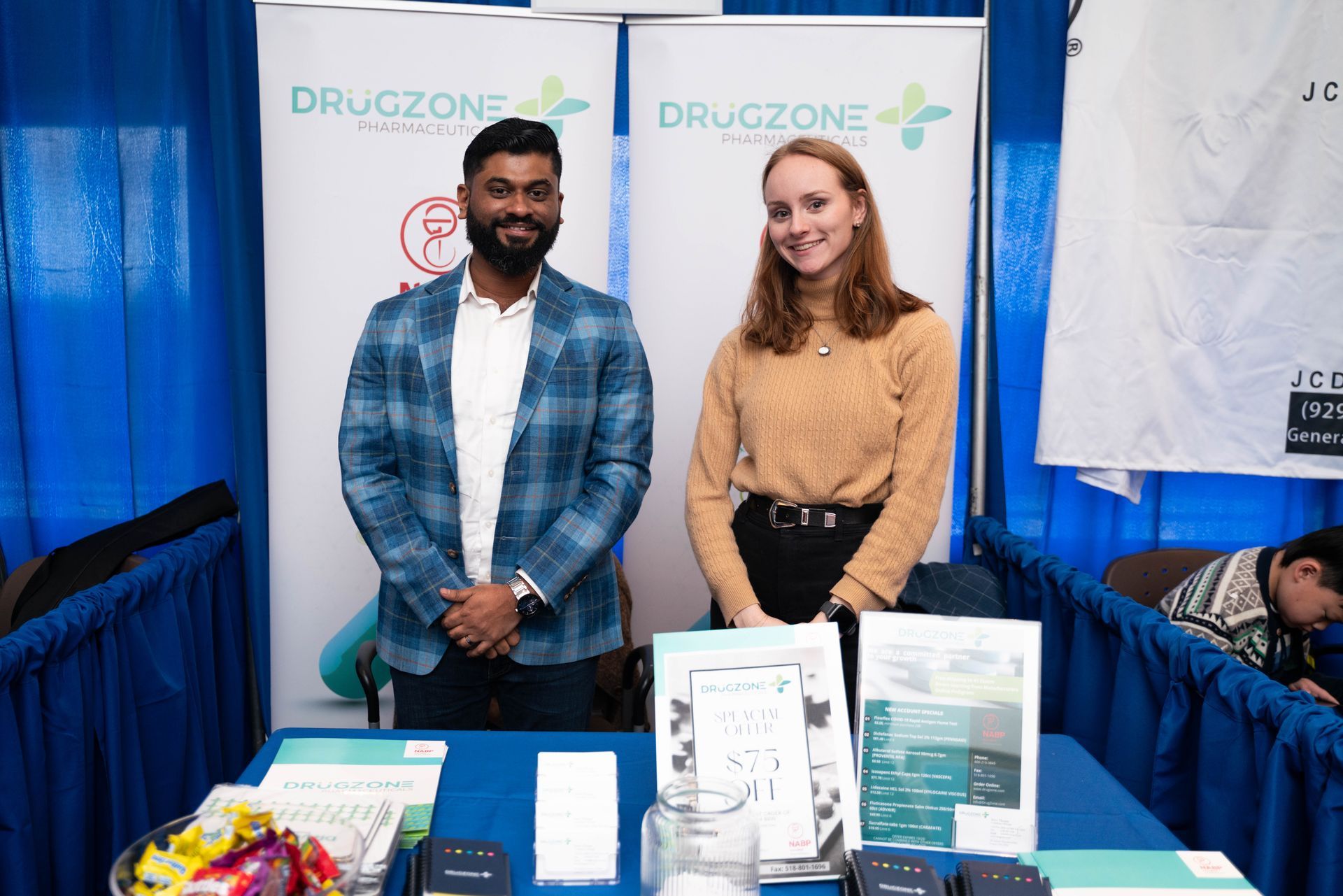 Two exhibitors at a vendor booth