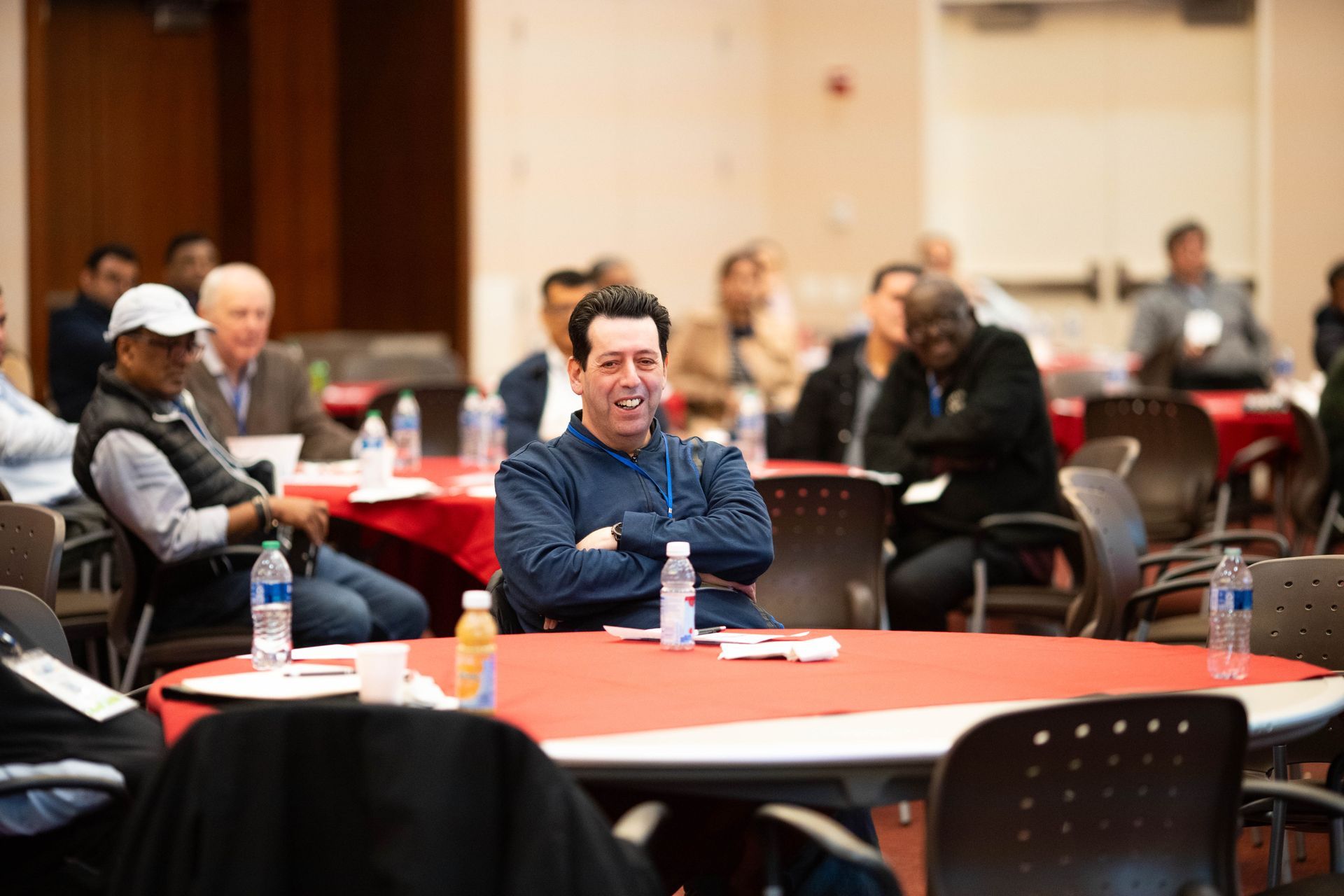 Attendees seated at tables during the afternoon program