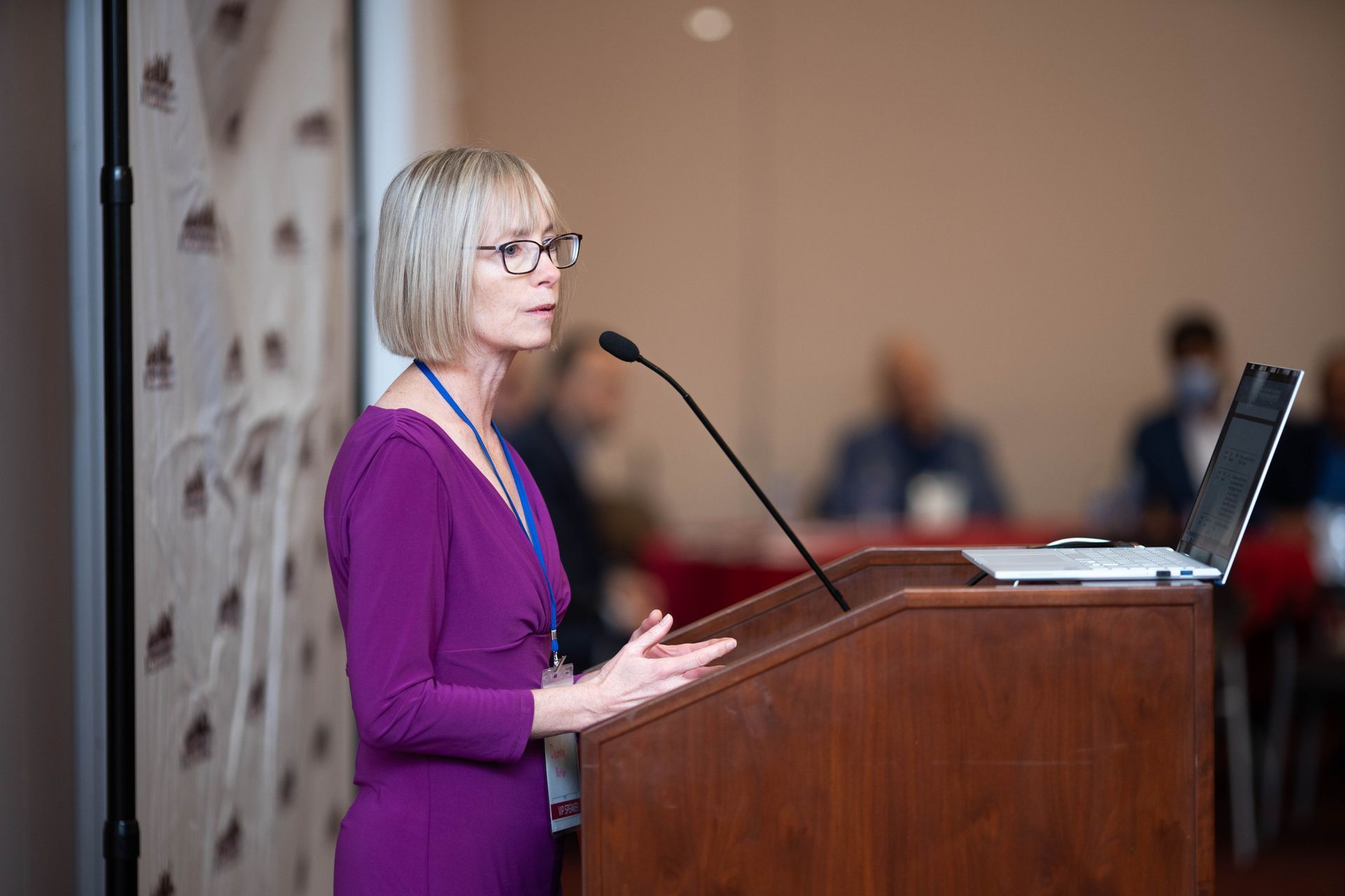 Presenter speaking at the podium during a continuing education session