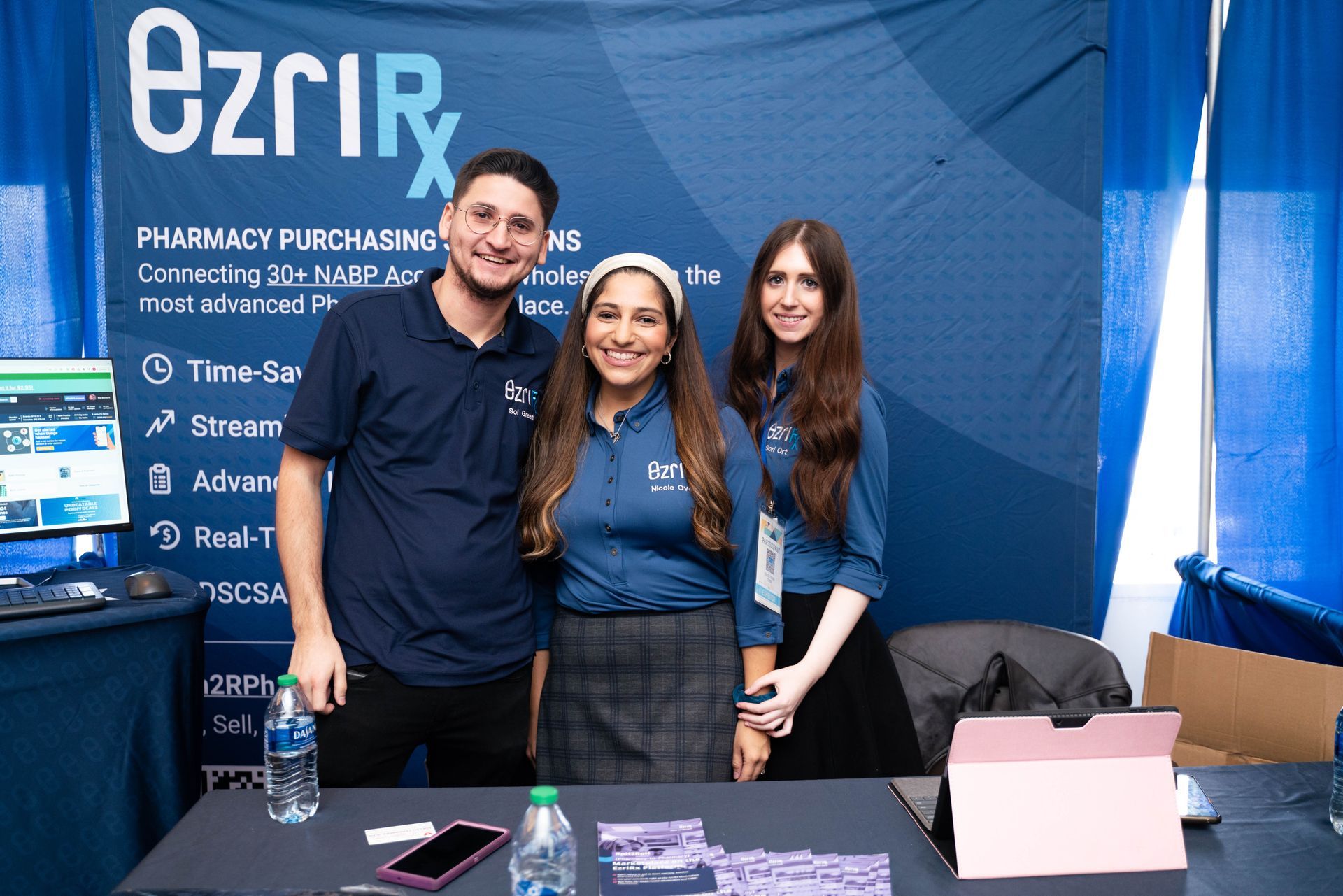 Exhibitor team at a pharmacy purchasing booth